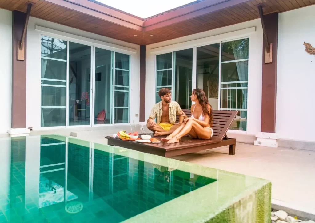 young couple relaxing in their brand new villa in bali